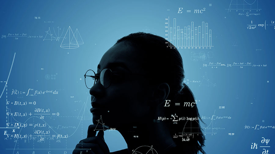 Photo showing a girl with glasses reading and analyzing mathematical equations..