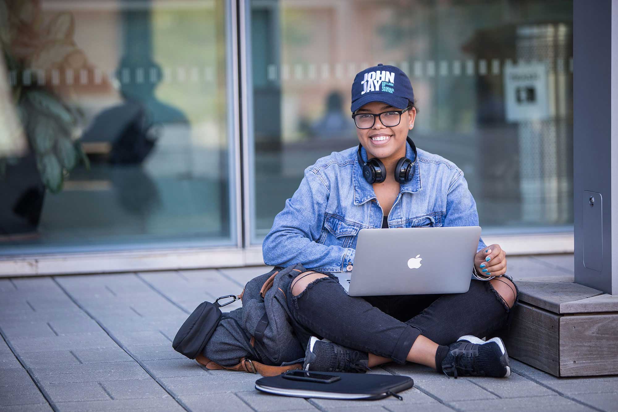 student in JJ cap