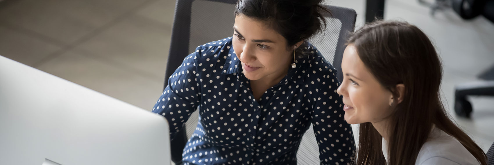 mentor and mentee at computer