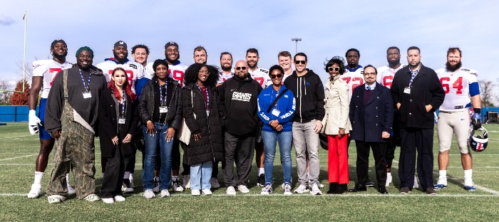 Hamilton (first row, fourth from left) with members of the  New York Giants team, other New York Giants Touchdown Fellows, and John Jay Staff