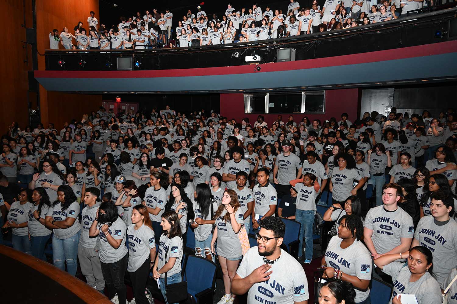 Students in the GWL Theater doing the t-shirt tradition