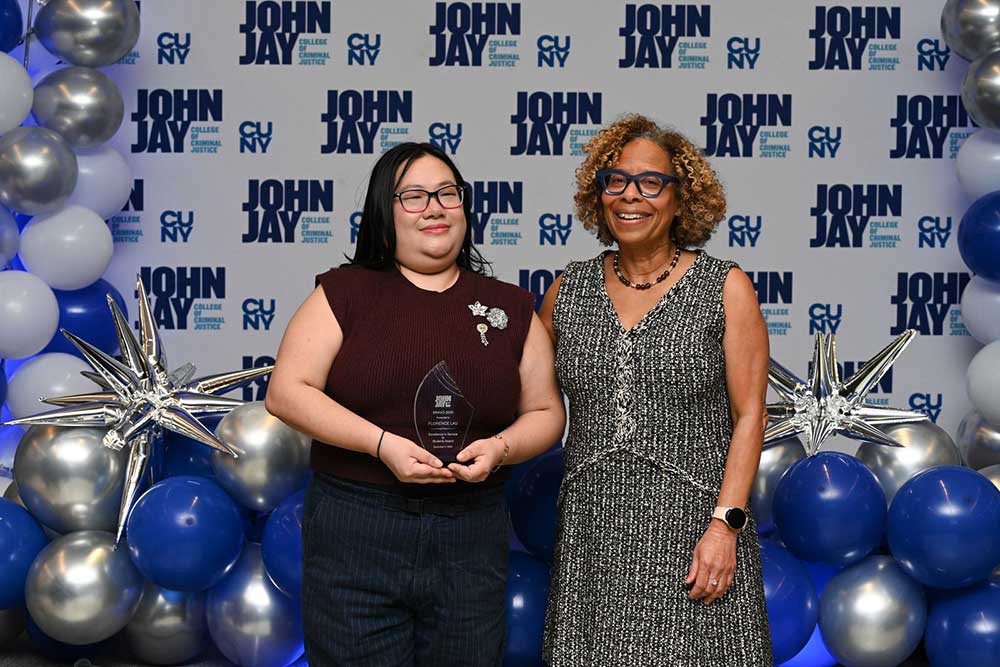 President Mason posing with award recipient at BRAVO 2025 event