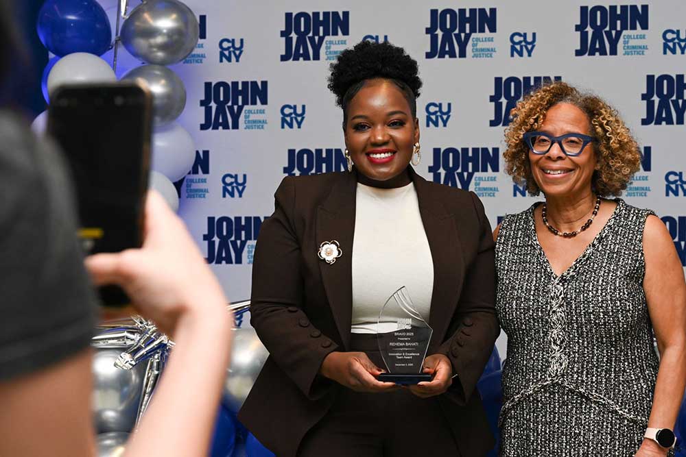 President Mason posing with award recipient at BRAVO 2025 event