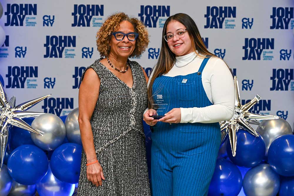 President Mason posing with award recipient at BRAVO 2025 event