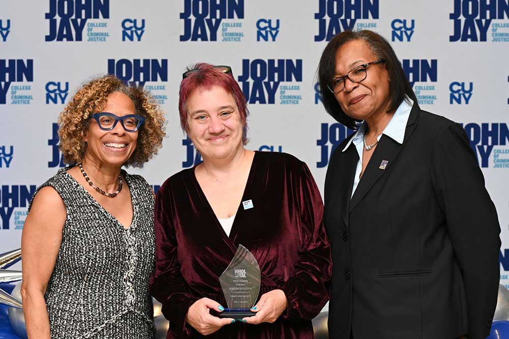 President Mason posing with award recipient at BRAVO 2025 event