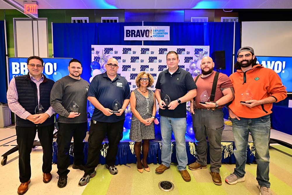 President Mason posing with award recipients at BRAVO 2025 event