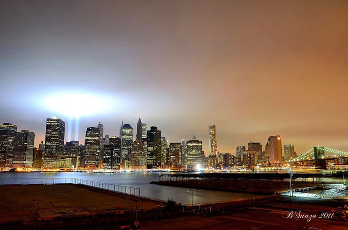 Manhattan skyline at night with hues of gold 