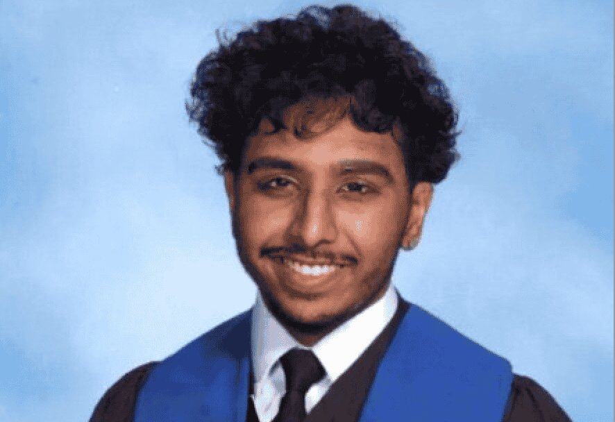 Parsva Shah, class of 2024, smiling and wearing a graduation robe