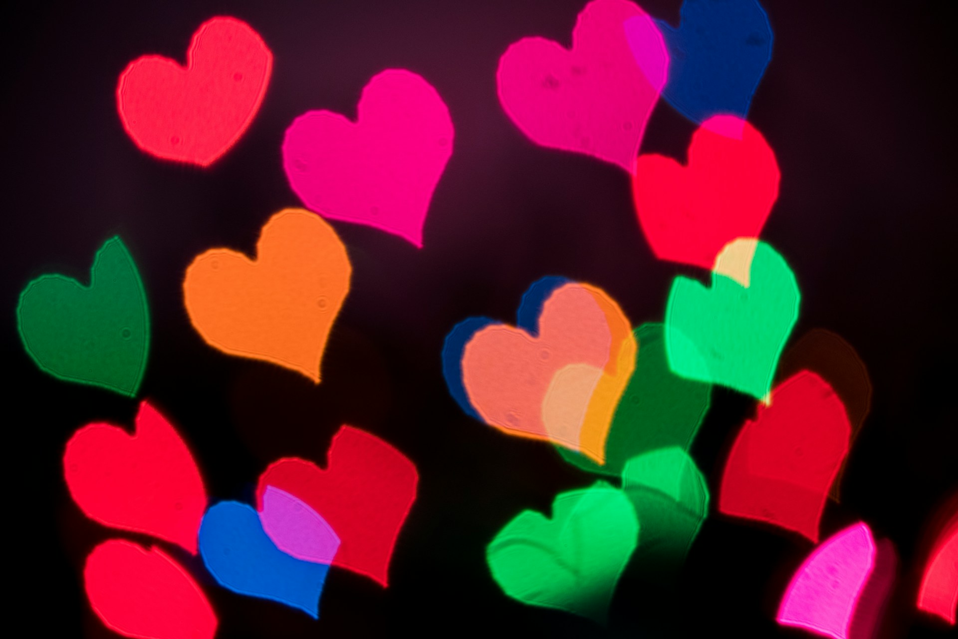 Multicolored hearts on a black background