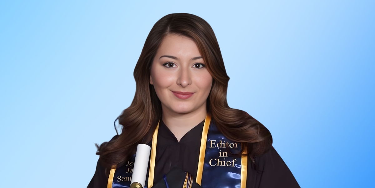 Alexandra Cortese, sits facing the camera. She is wearing her graduation gown and John Jay Sentinel stole
