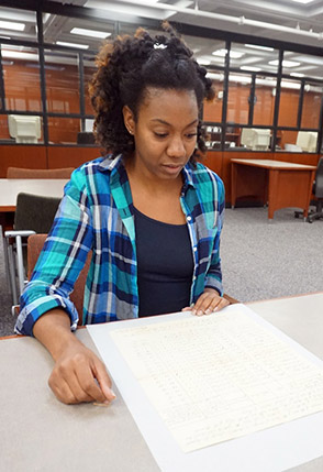 Valencia McMillan examining records