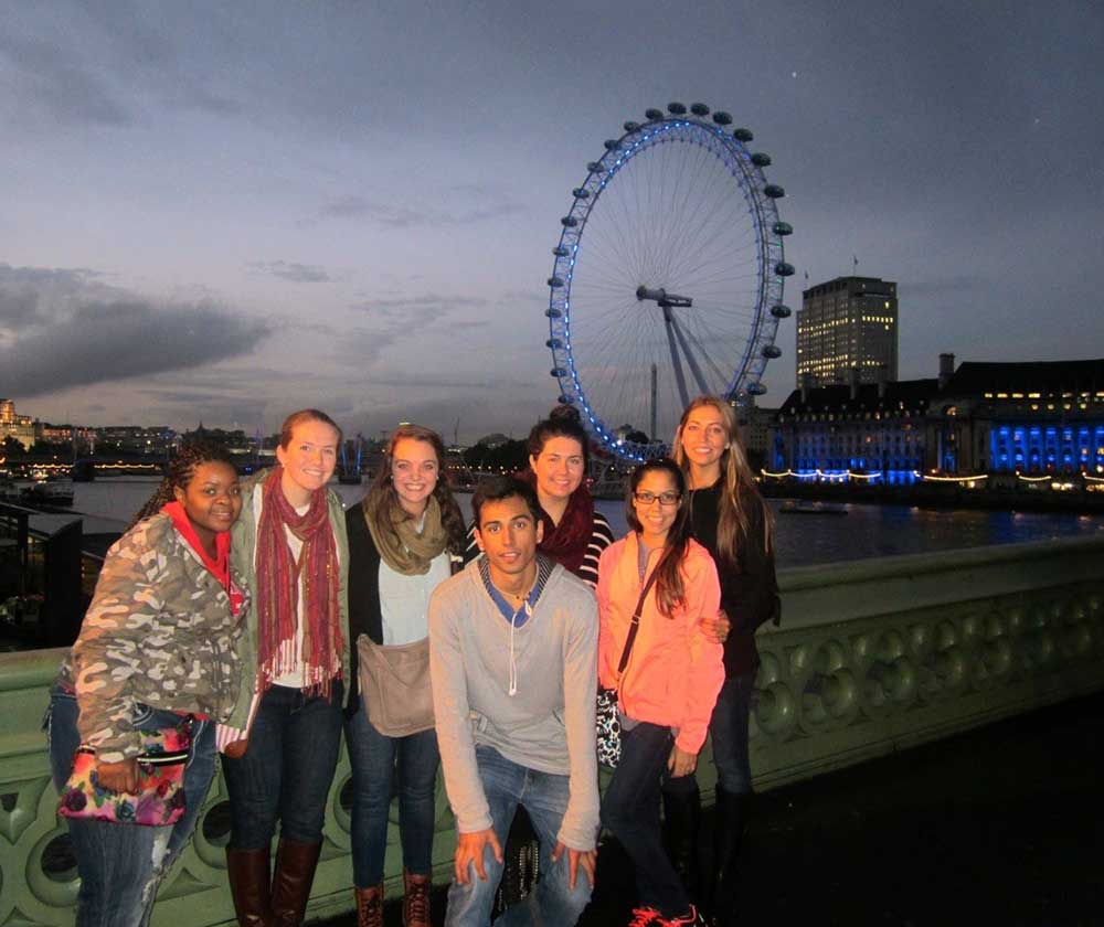 Students posing in front of the London Eye