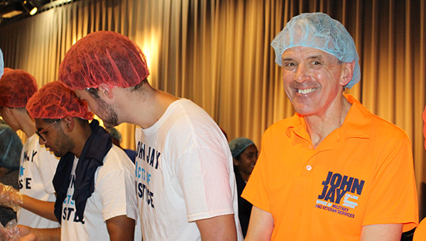 Richard Pusateri, Military and Veterans Services Manager, smiles during the meal packing event