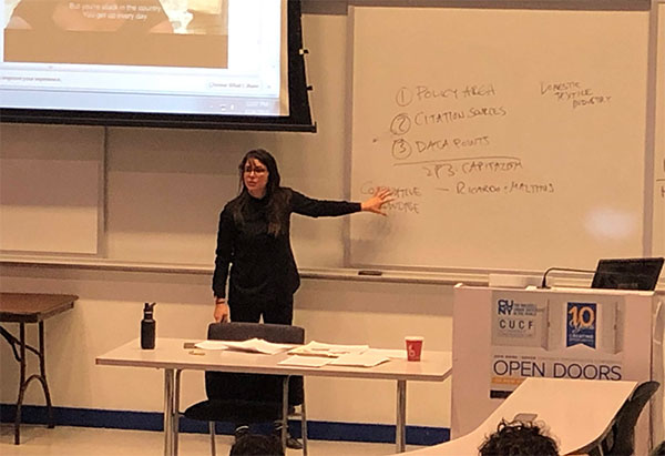 Economics Professor Sara Bernardo teaching. 