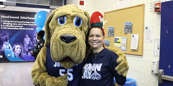 Bloodhound and volunteer at the Children's Holiday party