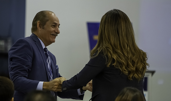 Linares greeting Assemblywoman Cruz 