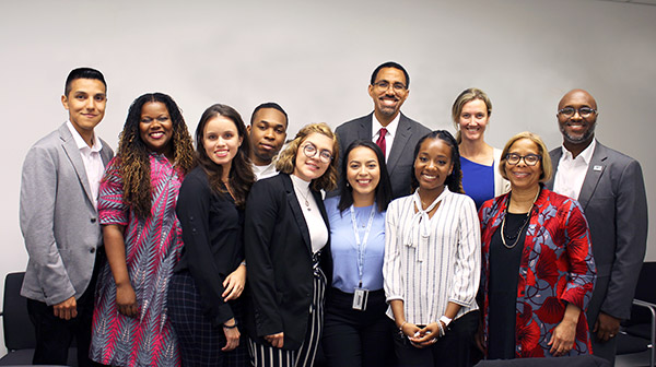 (left to right)  Bosco Villavicencio ’19; Dara Byrne, Associate Provost and Dean of Undergraduate Studies; Yuliya Samboryk ’19; Shane Worrell-Louis ’19; Brianna Espinoza; John B. King Jr.;  Leslie Gutelius; Achora Recille; Laura Ginns, Vice President; Karol V. Mason, President; and Delandra Hunter, ACE Director