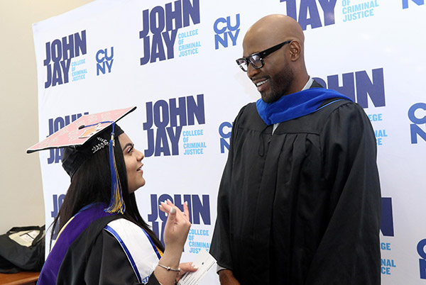 Karamo Brown chatting with valedictorian Jasmine Awad