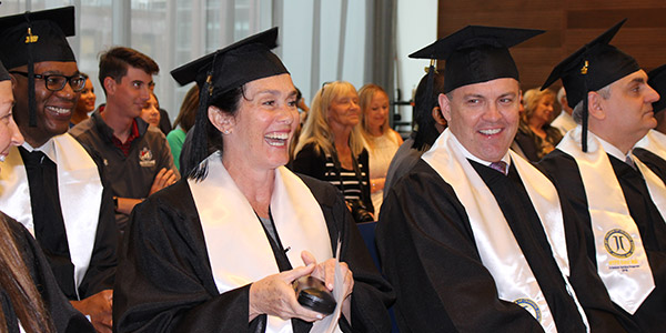 Pollock (center) sharing a laugh with her classmates