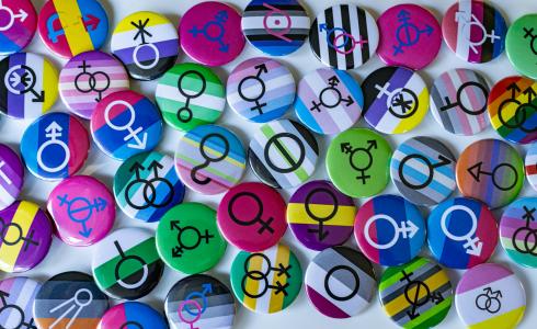 Image of buttons with different gender symbols on them