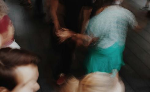 Blurry image of people dancing on a dance floor