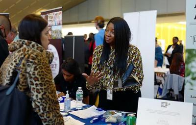 A student speaks to a recruiter at the Fall 2023 Career & Internship Fair